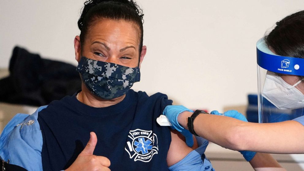 PHOTO: A worker of the New York City Fire Department Bureau of Emergency Medical Services receives a COVID-19 vaccine in the Manhattan borough of New York, Dec. 23, 2020.