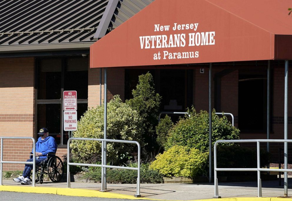PHOTO: A man sits outside the New Jersey Veterans Home at Paramus, a state-run home for former members of the US military in Paramus, N.J. on  May 12, 2020.