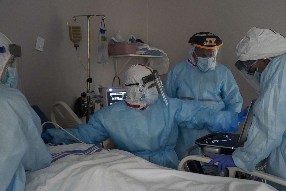 PHOTO: Members of the medical staff treat a patient in the COVID-19 intensive care unit at the United Memorial Medical Center on July 28, 2020, in Houston.