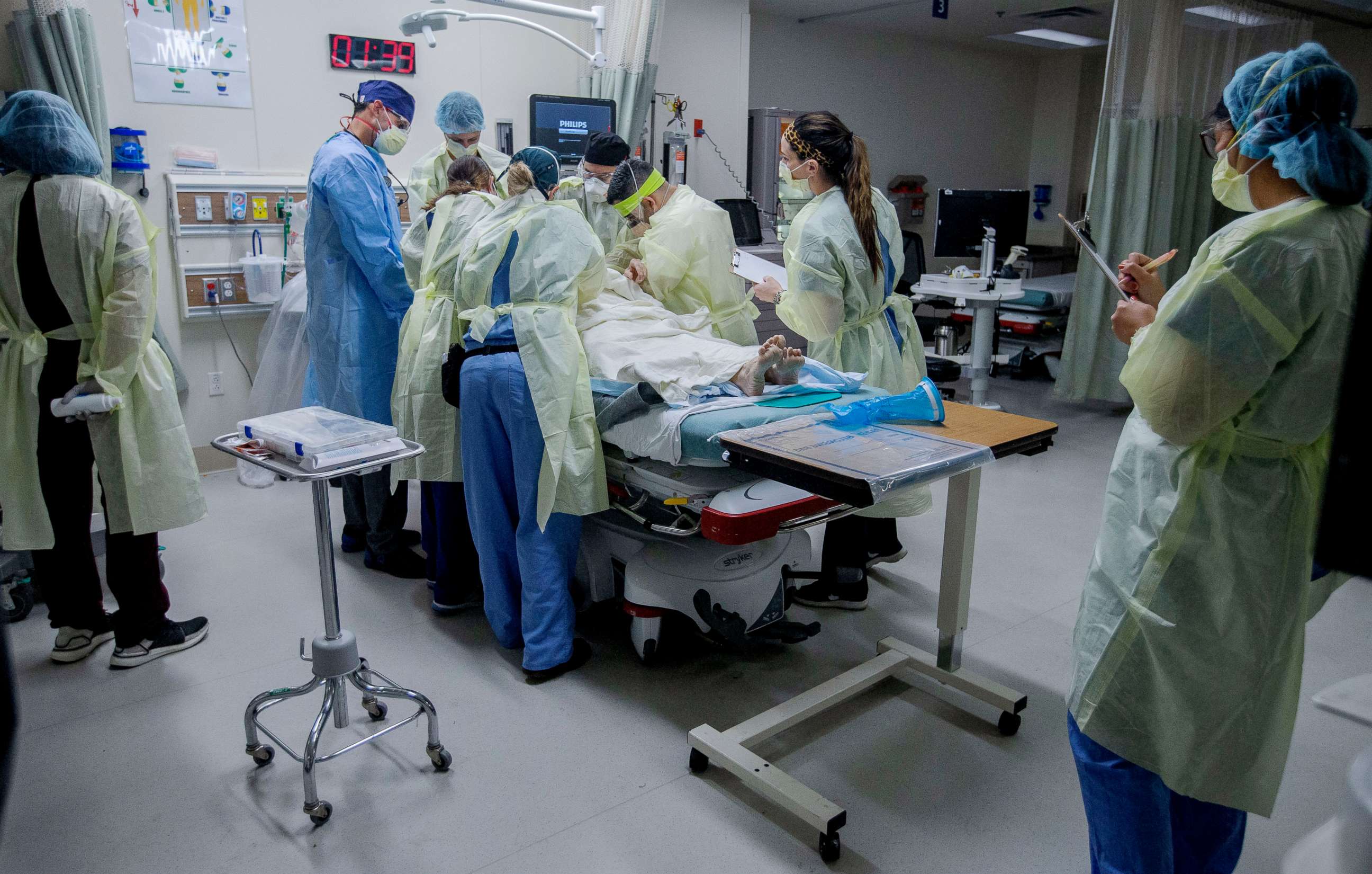 PHOTO: Medical workers help a patient in the emergency room at Riverside University Health System in Moreno Valley, Calif., June 26, 2020.