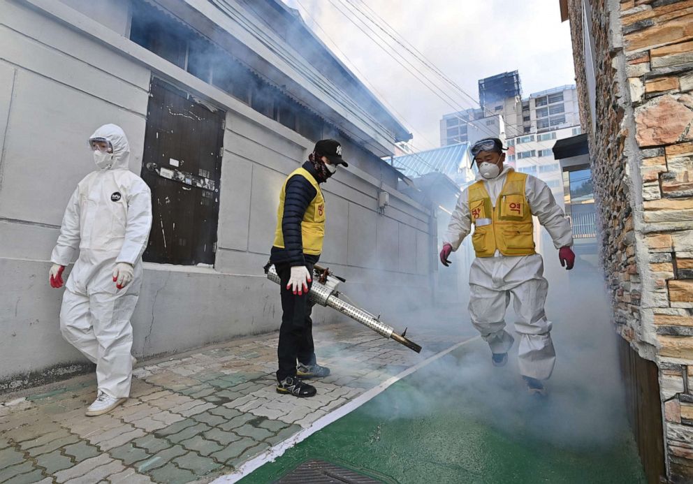 PHOTO: A South Korean health worker sprays disinfectant as part of preventive measures against the spread of the COVID-19 coronavirus, in Daegu, South Korea, Feb. 27, 2020.