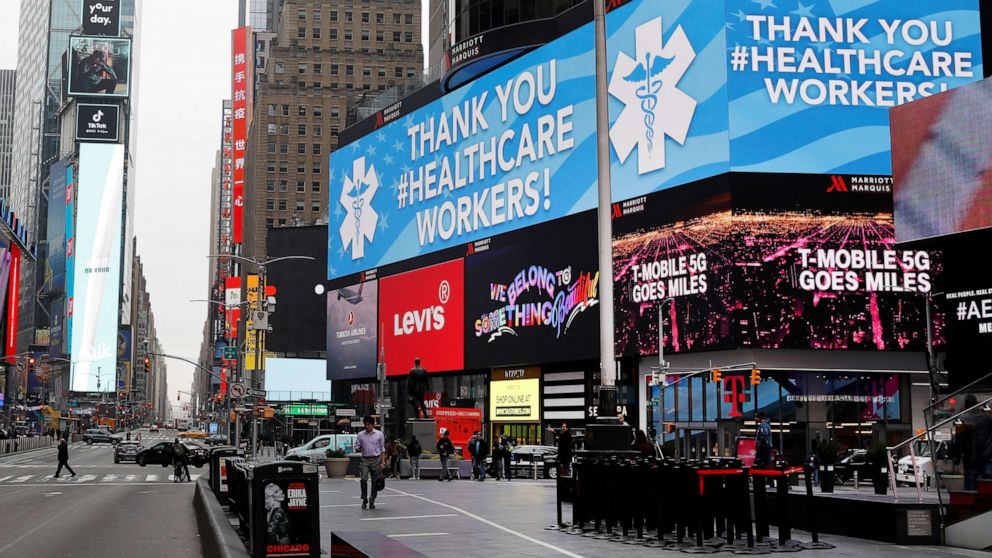 PHOTO: A message thanking healthcare workers during the coronavirus outbreak is seen on an electronic billboard in a nearly empty Times Square in Manhattan in New York, March 20, 2020.