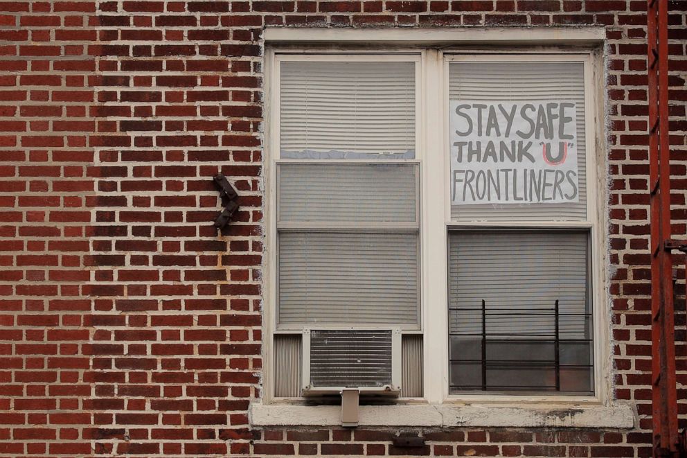 PHOTO: A sign thanking front-line workers is seen on an apartment window, during the outbreak of the coronavirus disease in the Brooklyn borough of New York, April 8, 2020.