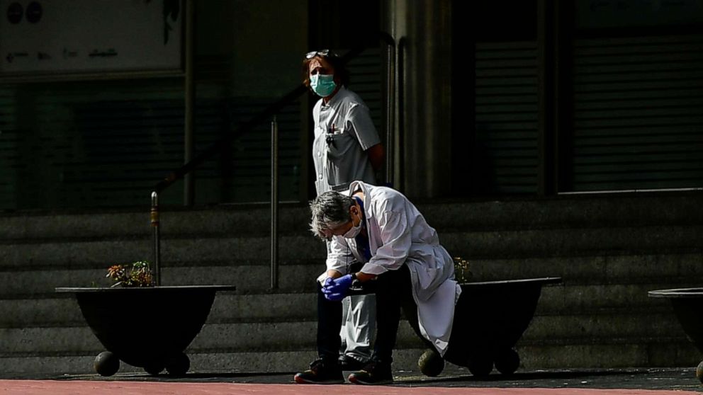 PHOTO: Health services staff members protest outside the Txagorritxu hospital demanding more protection equipment, after a Spanish nurse died Thursday from coronavirus COVID-19 in a hospital, in Vitoria, northern Spain, March 20, 2020.