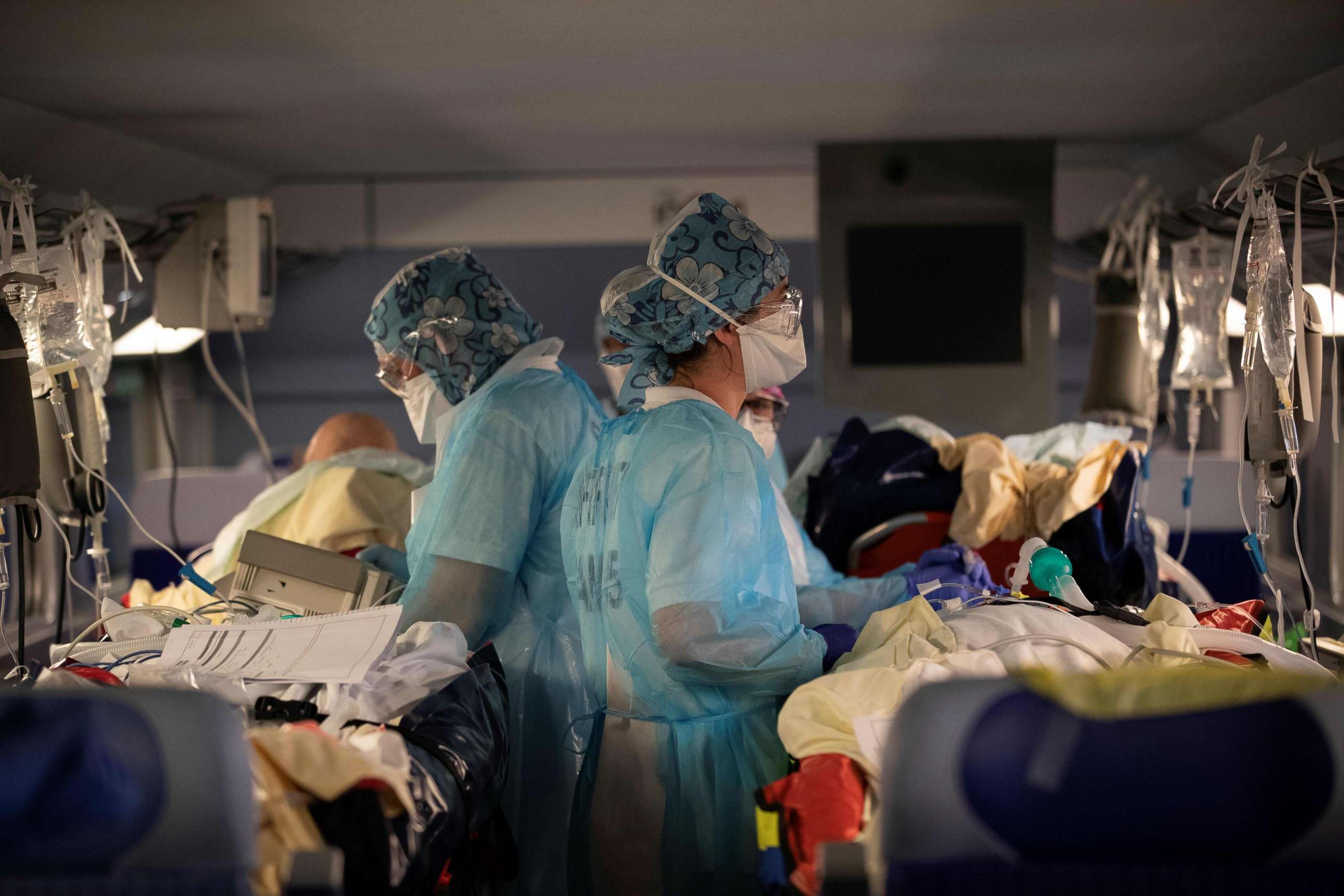 PHOTO: Medical staff install patients infected with the COVID-19 aboard a high speed train at a train station in Paris on April 1, 2020, as part of the evacuation of 36 patients in two separate trains towards hospitals of Brittany.