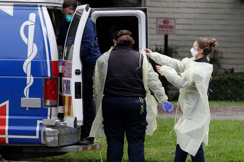 PHOTO: Ambulance personnel get ready to evacuate patients from the Magnolia Rehabilitation and Nursing Center in Riverside, Calif., April 8, 2020.