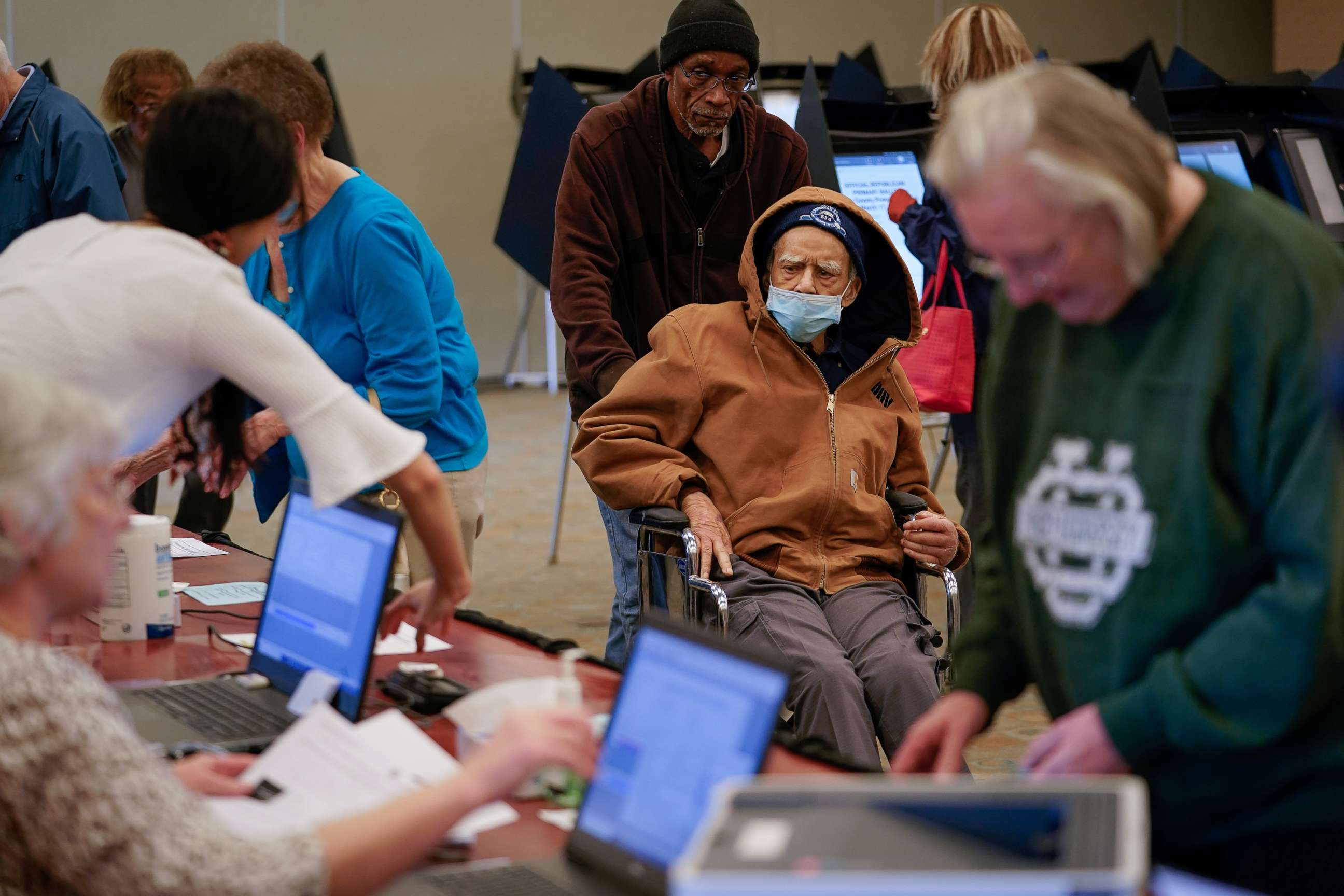 PHOTO: Robert Harrison, 96, arrives to vote while wearing a mask to prevent exposure to novel coronavirus, in Hamilton, Ohio, March 12, 2020.