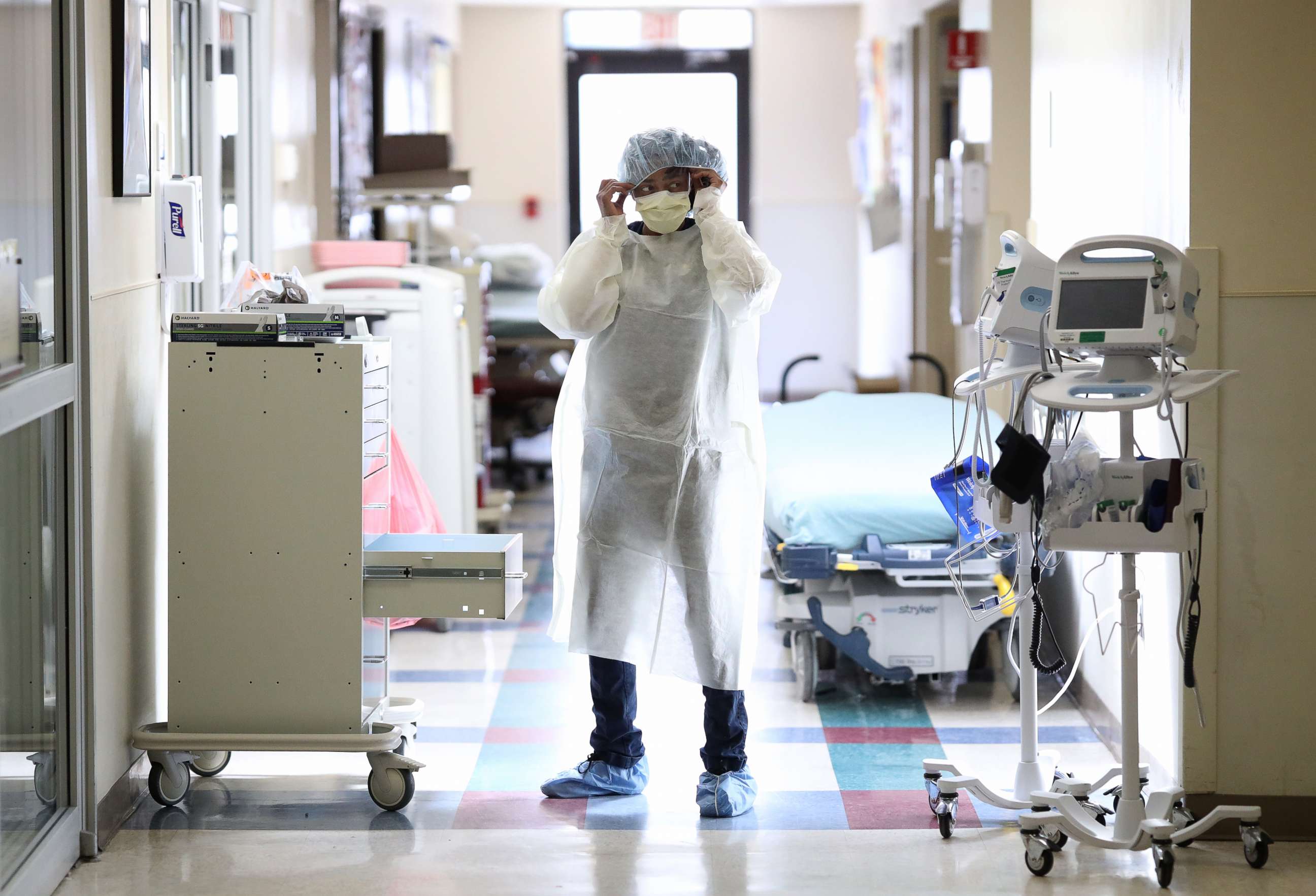 PHOTO: Nurses in the emergency department of MedStar St. Mary's Hospital don personal protective equipment before entering the room of a patient suspected of having coronavirus April 8, 2020, in Leonardtown, Md.