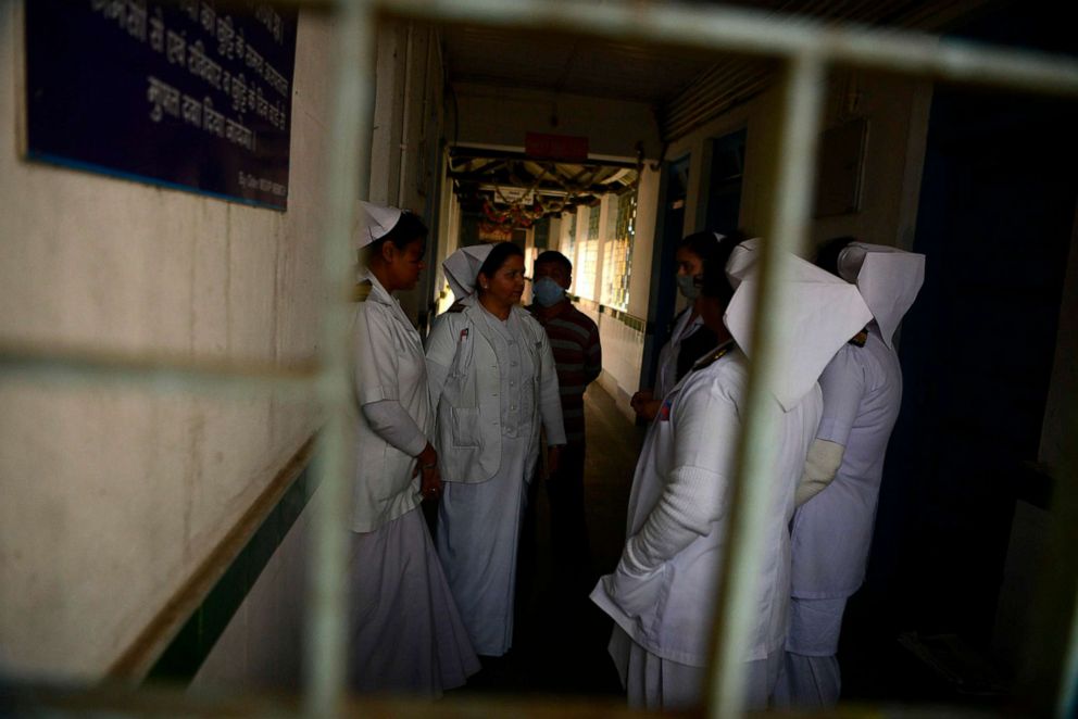 PHOTO:Medical staff wearing facemasks walk inside of an isolation ward opened as a preventative measure for coronavirus at the North Bengal Medical college and Hospital in Siliguri, India, Feb. 4, 2020.