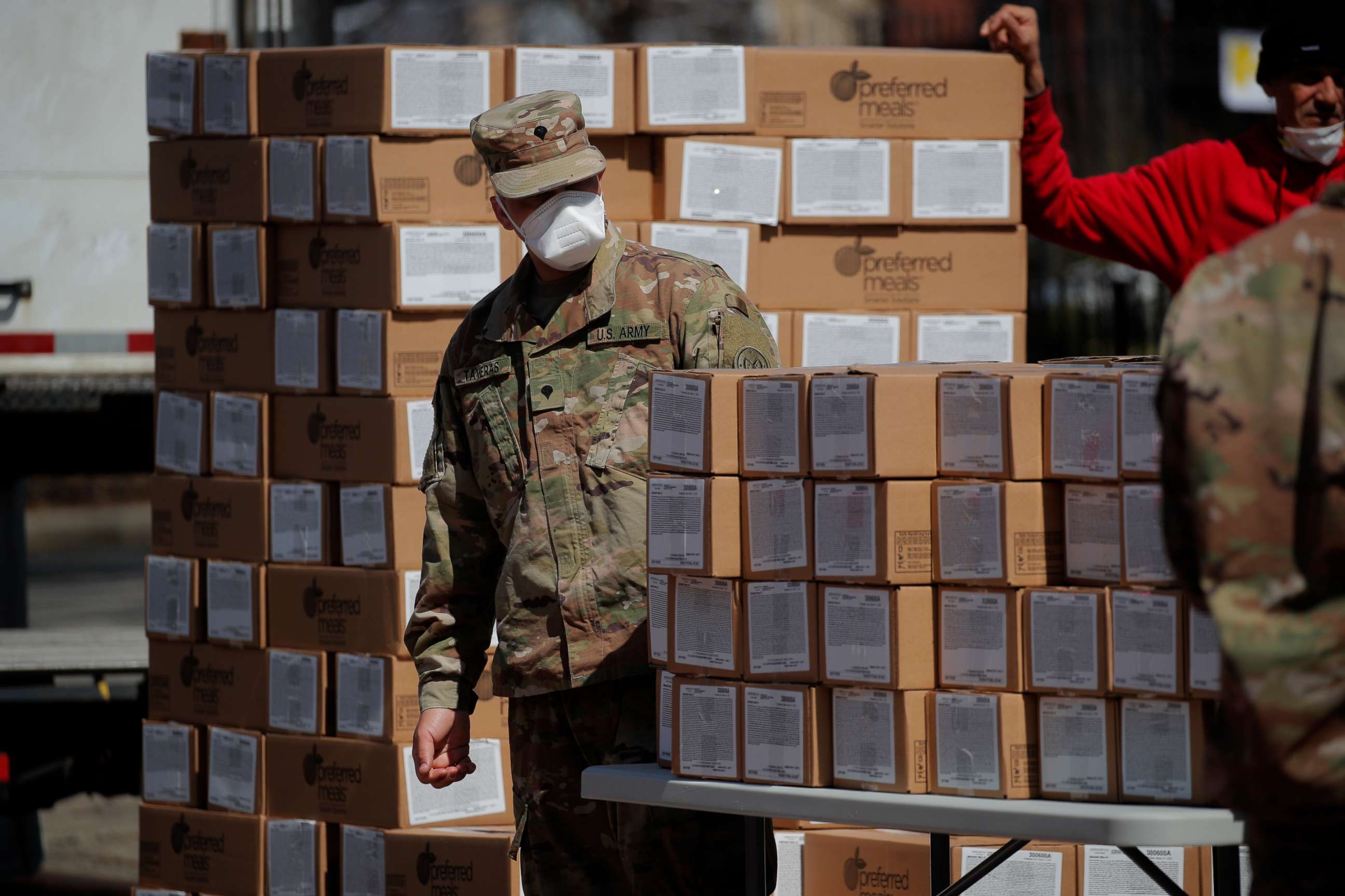 PHOTO: U.S. Army National Guard personnel distribute boxes of free meals to residents in the East Harlem section of Manhattan during the outbreak of the coronavirus disease in New York, April 1, 2020.