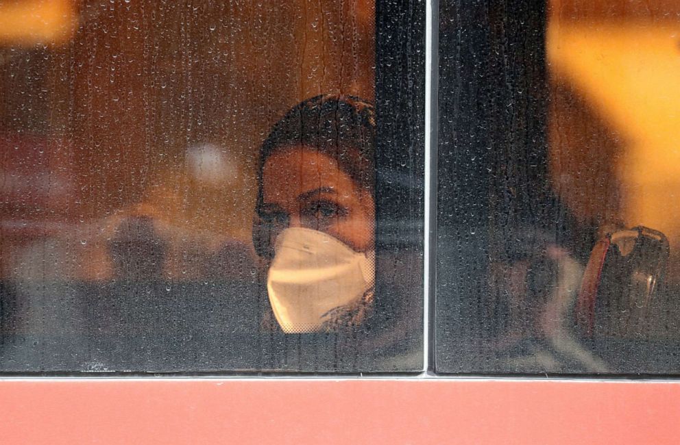 PHOTO: An woman wears a face mask  on a bus in Tehran, Iran, Feb. 26, 2020. 