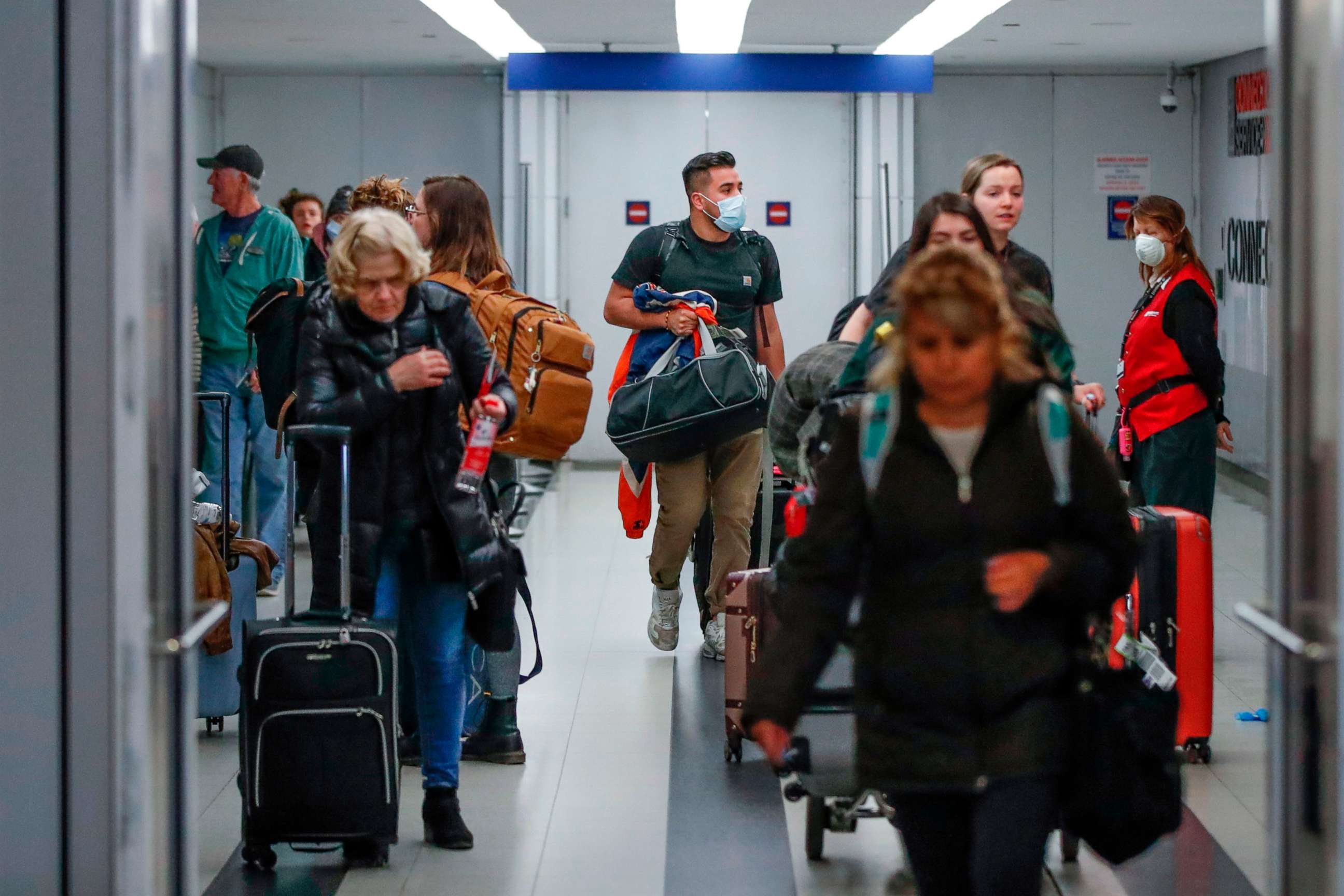 PHOTO: Travelers arrive at the international terminal of the O'Hare Airport in Chicago, on March 15, 2020.