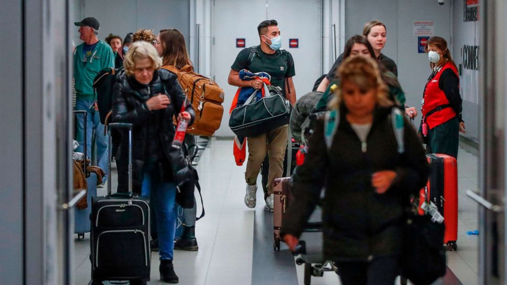 PHOTO: Travelers arrive at the international terminal of the O'Hare Airport in Chicago, on March 15, 2020.