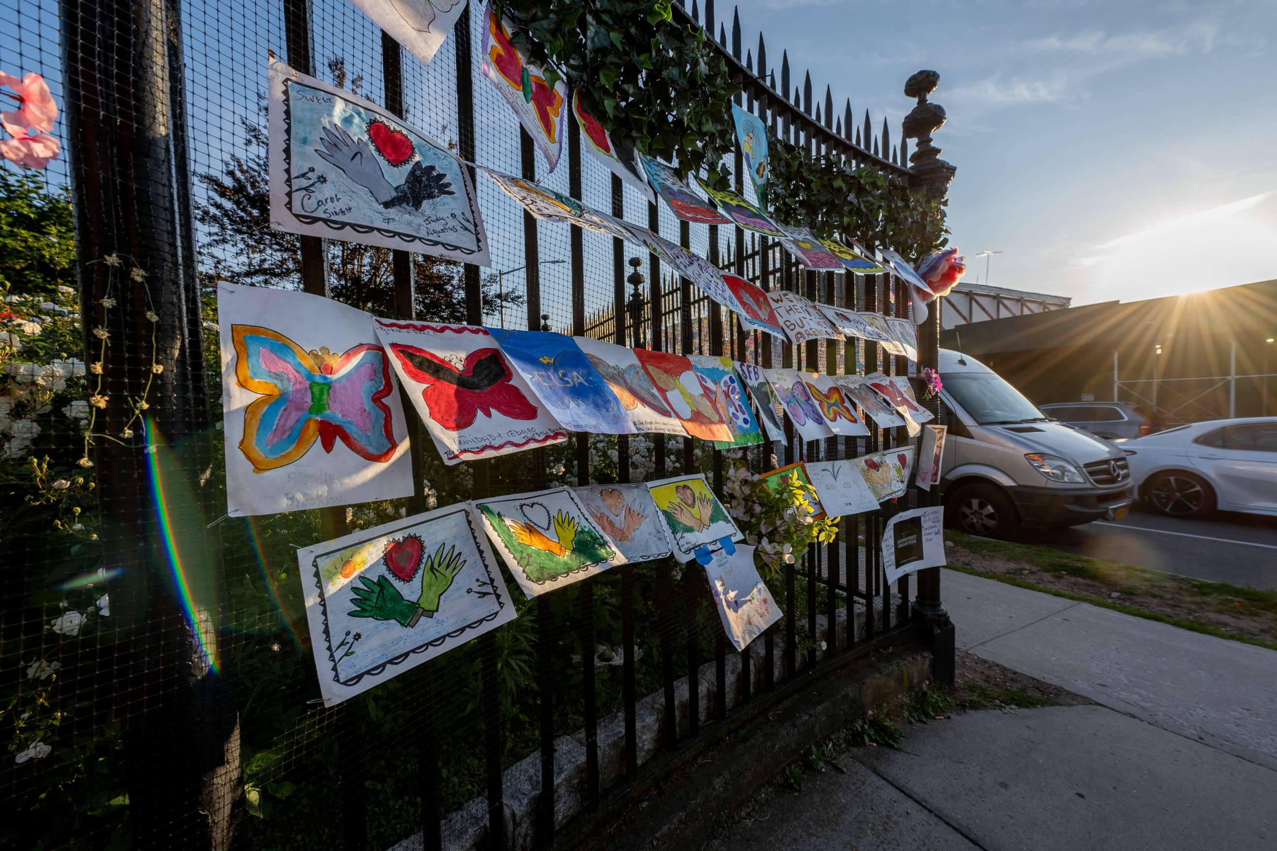 PHOTO: Notes with names of COVID-19 victims line the fence at the 25th street entrance of Green-Wood Cemetery in the Brooklyn borough of New York, June 17, 2021.