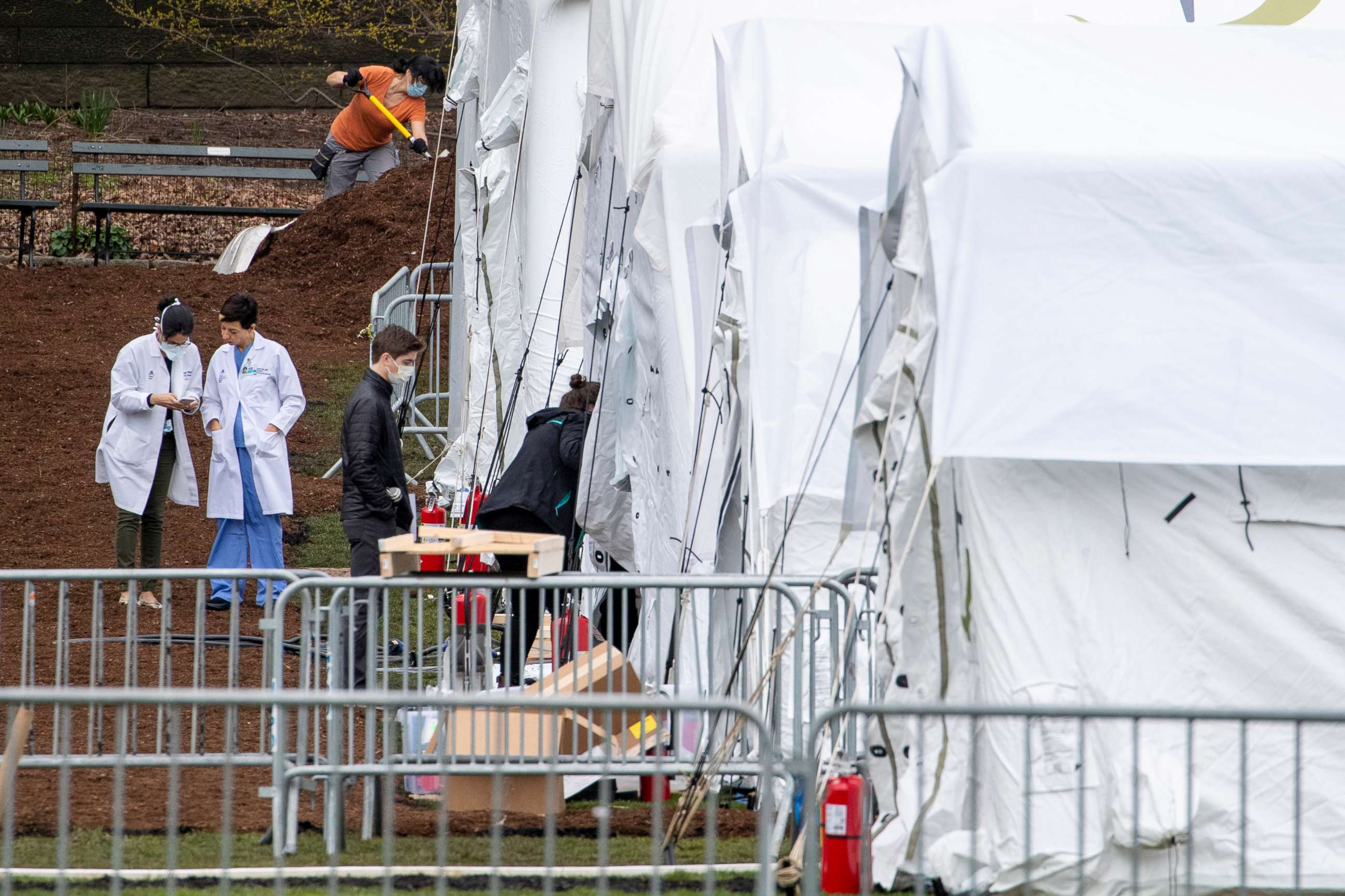 PHOTO: A Samaritan's Purse crew and medical personnel work on preparing to open a 68 bed emergency field hospital specially equipped with a respiratory unit in New York's Central Park, March 31, 2020.