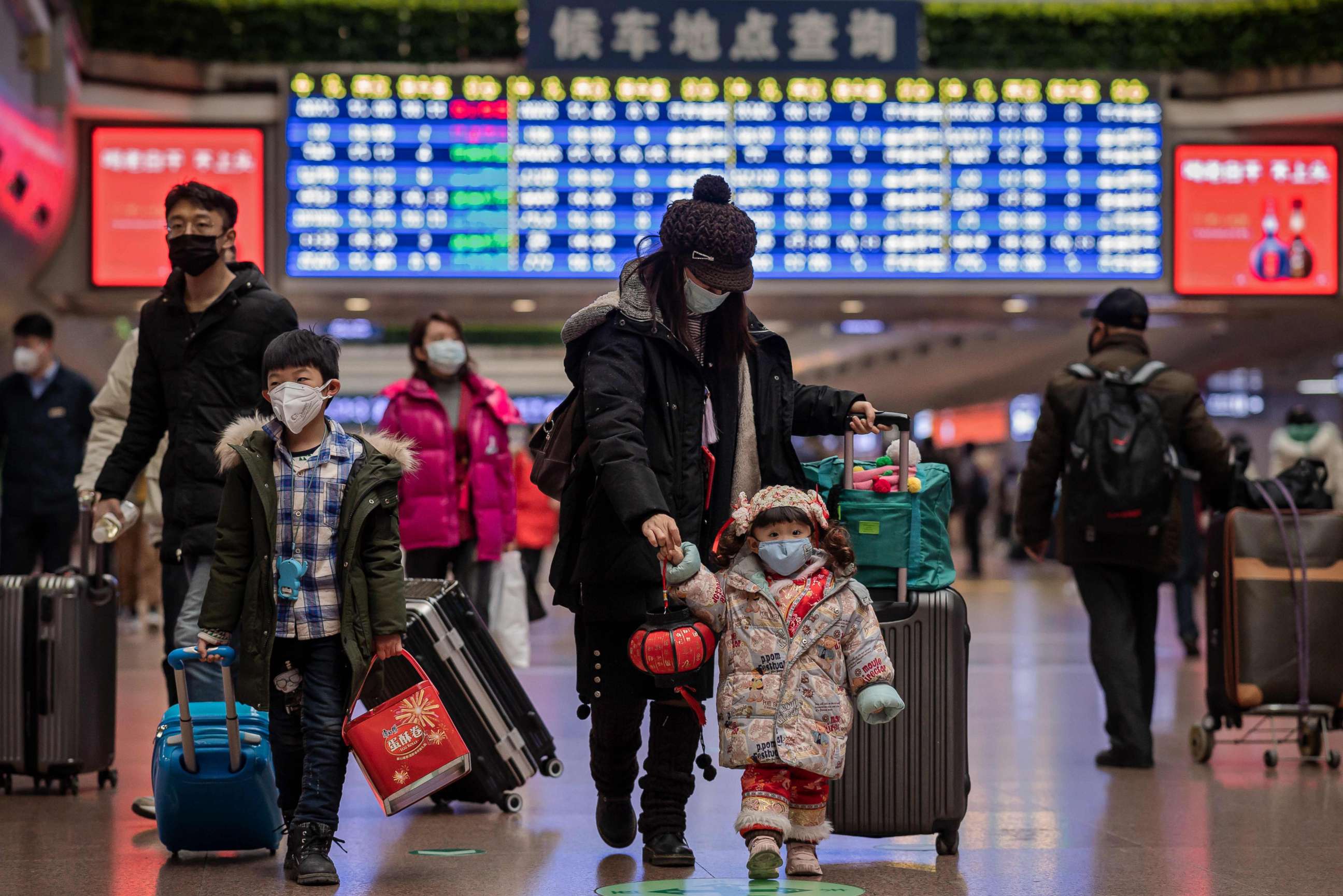 PHOTO: Travelers wear face masks at Beijing West Railway Station in Beijing, Jan. 24, 2020.