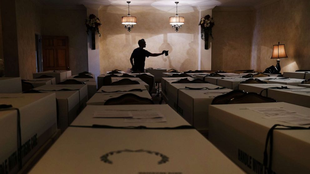 PHOTO: A worker organizes bodies in the Gerard Neufeld funeral home in Queens on April 22, 2020, in New York.