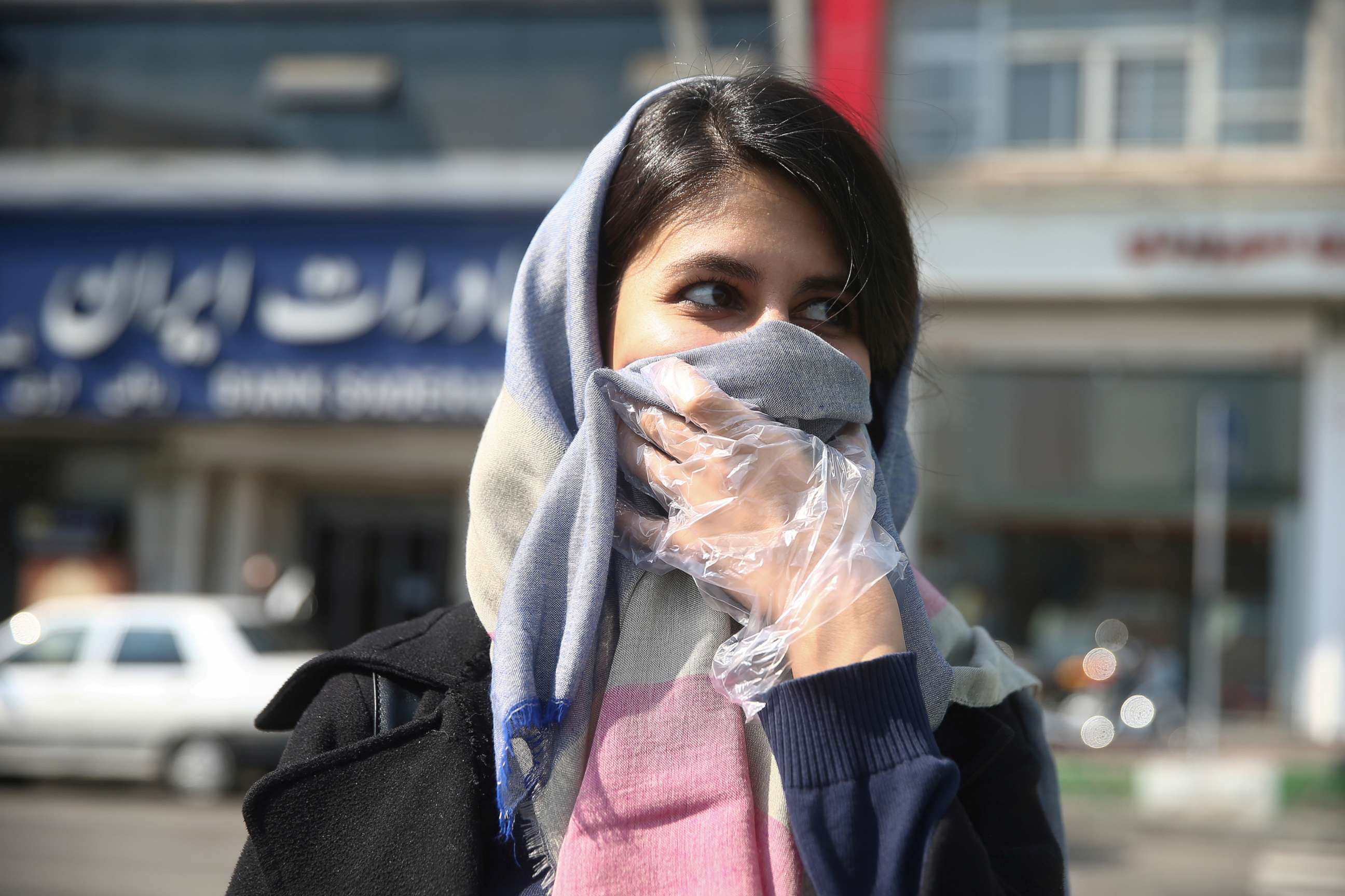 PHOTO: An Iranian woman wears a protective face mask, following the coronavirus outbreak, as she walks in Tehran, Iran, March 5, 2020. 