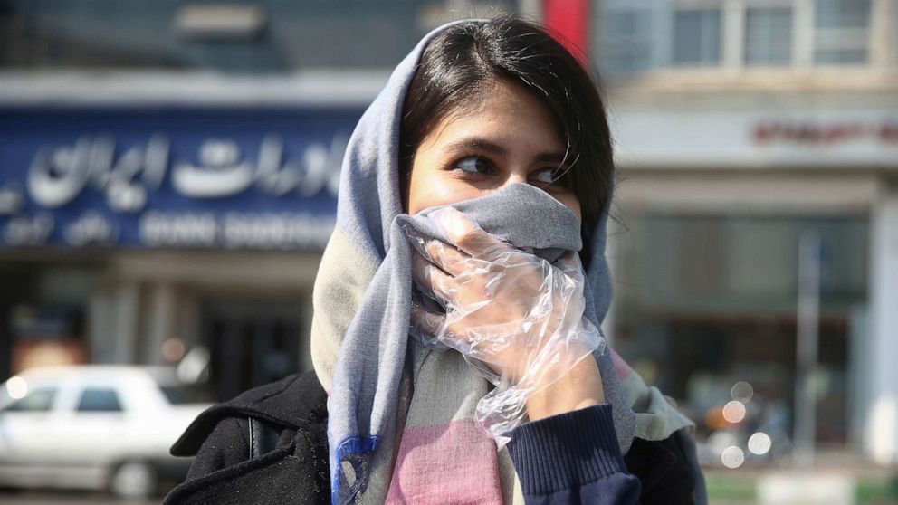PHOTO: An Iranian woman wears a protective face mask, following the coronavirus outbreak, as she walks in Tehran, Iran, March 5, 2020. 