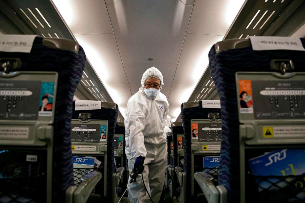 PHOTO: A worker from a cleaning and disinfection service sprays disinfectant in a train as part of efforts to prevent the spread of a new virus which originated in the Chinese city of Wuhan at Suseo railway station in Seoul, South Korea, Jan. 24, 2020.
