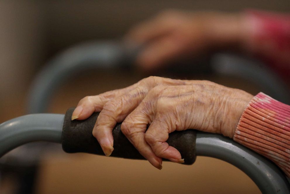 PHOTO: A resident watches the activity at an assisted living facility in Boston during the coronavirus pandemic, Sept. 02, 2020.