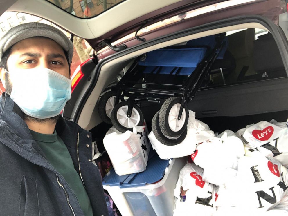 PHOTO: Manashe Khaimov volunteers with the Bukharian Jewish Union in the Queens Jewish Community Council package delivery during socially-distanced Passover preparations in the Queens borough of New York, April 5, 2020.