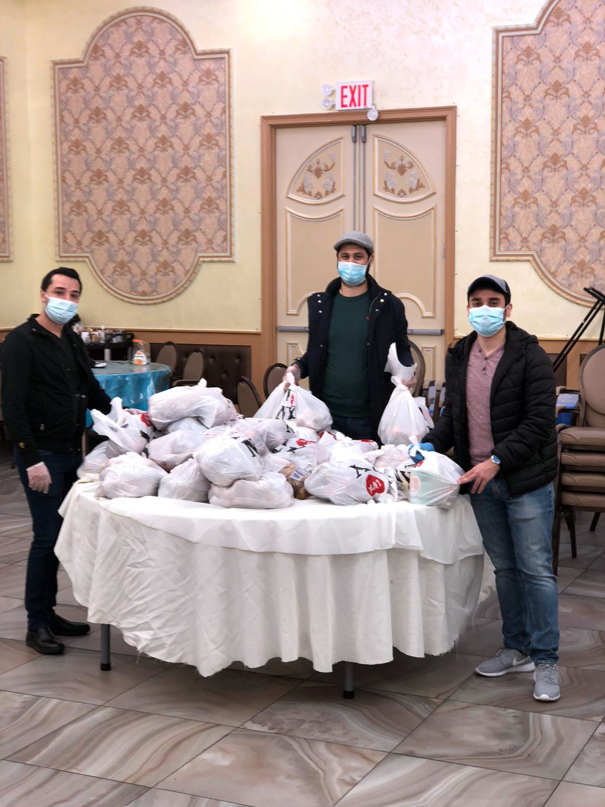 PHOTO: Manashe Khaimov, center, volunteers with the Bukharian Jewish Union in the Queens Jewish Community Council package delivery during socially-distanced Passover preparations in the Queens borough of New York, April 5, 2020.