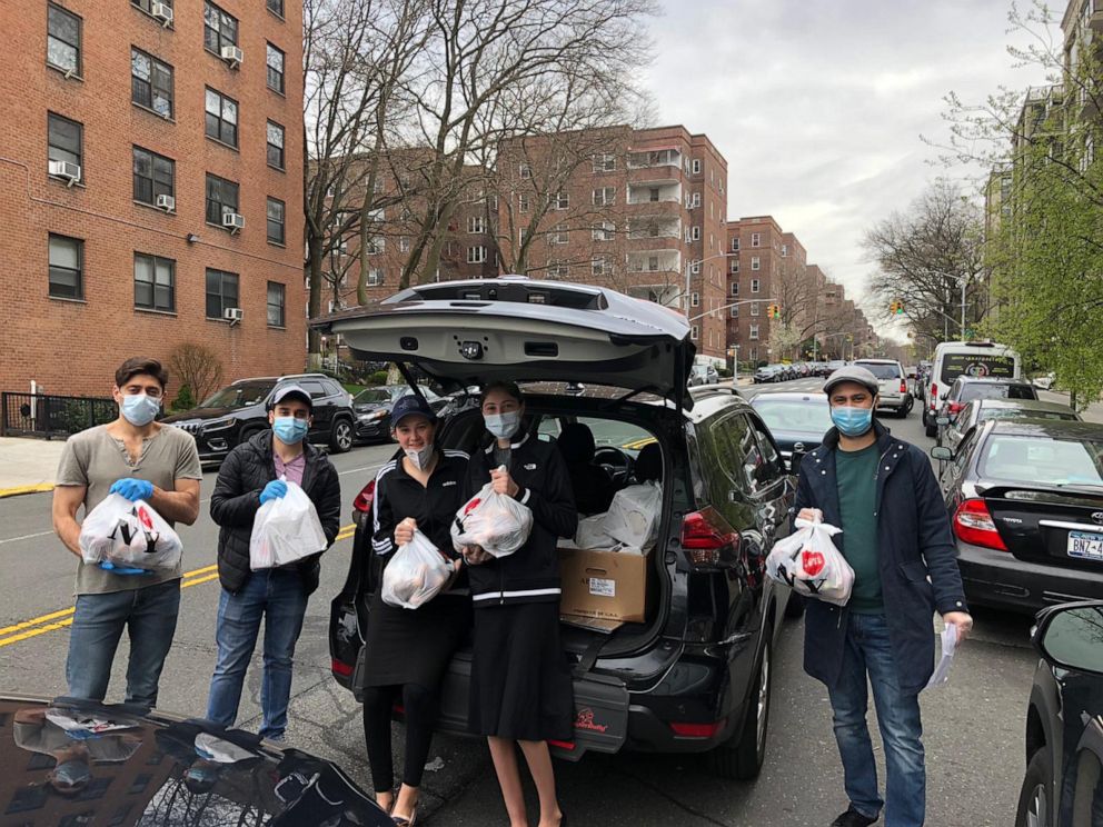 PHOTO:  Manashe Khaimov, right, volunteers with the Bukharian Jewish Union in the Queens Jewish Community Council package delivery during socially-distanced Passover preparations in the Queens borough of New York, April 5, 2020.
