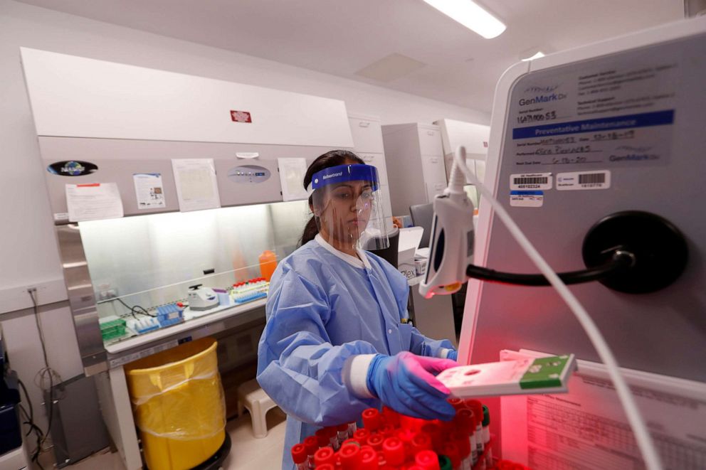 PHOTO: A medical technologist tests a respiratory panel at Northwell Health Labs, where the same test will be used on the COVID-19 in Lake Success, N.Y., March 11, 2020.