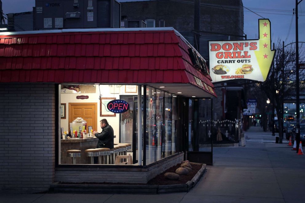PHOTO: A customer has breakfast at Don's Grill in the Pilsen neighborhood on March 16, 2020, in Chicago.