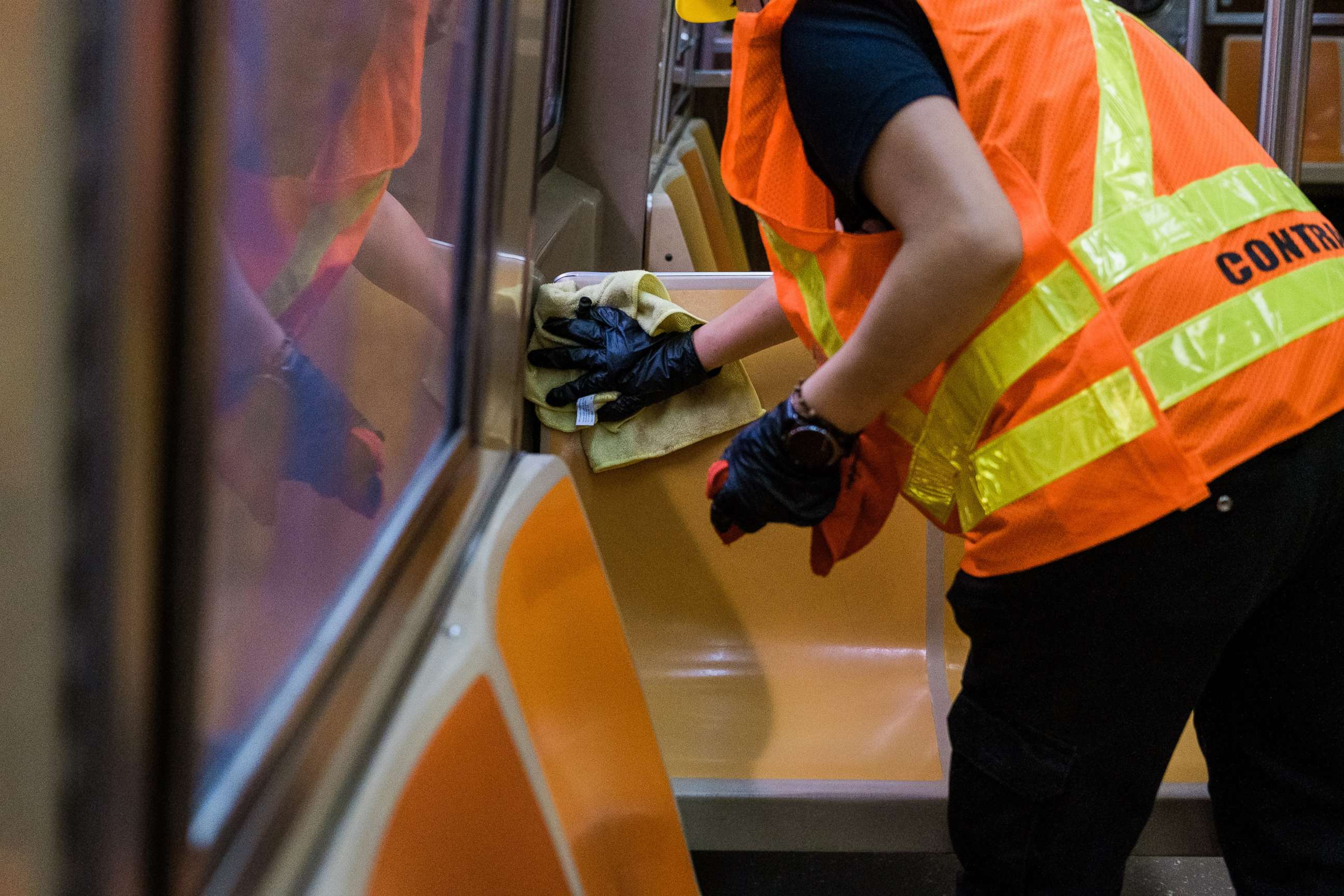 PHOTO:A contractor for the Metropolitan Transit Authority (MTA) wipes a bench of a subway train in New York, June 10, 2020.