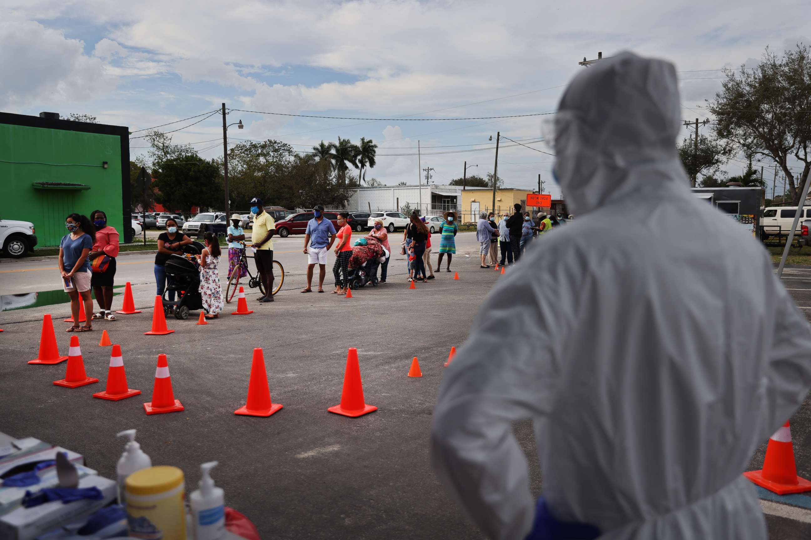 PHOTO: People line up to receive rapid COVID-19 tests on Feb. 17, 2021, in Immokalee, Fla.