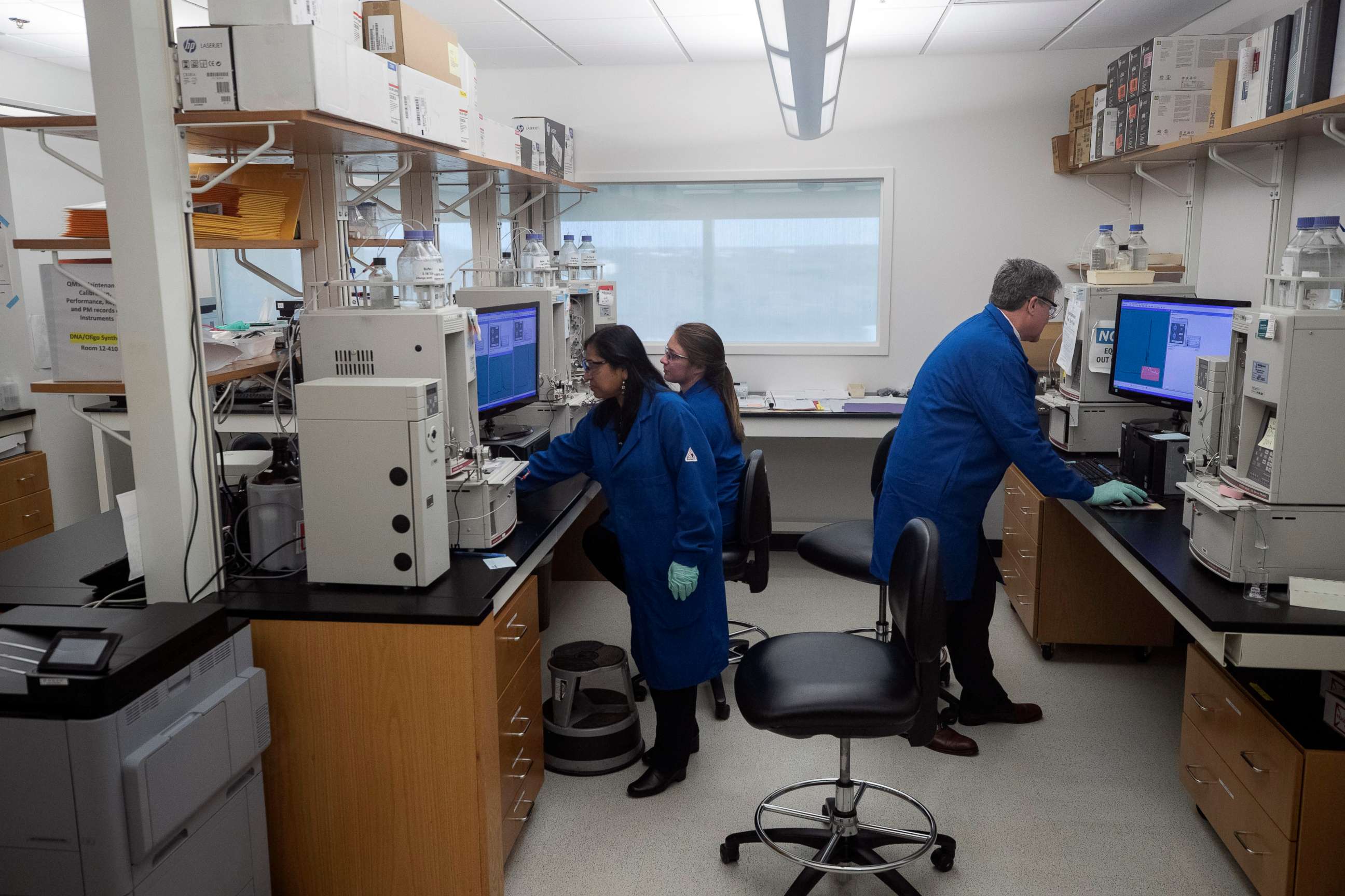 PHOTO: People work in a lab after President Donald Trump watched during his meeting about the coronavirus at the Centers for Disease Control and Prevention, Friday, March 6, 2020 in Atlanta.