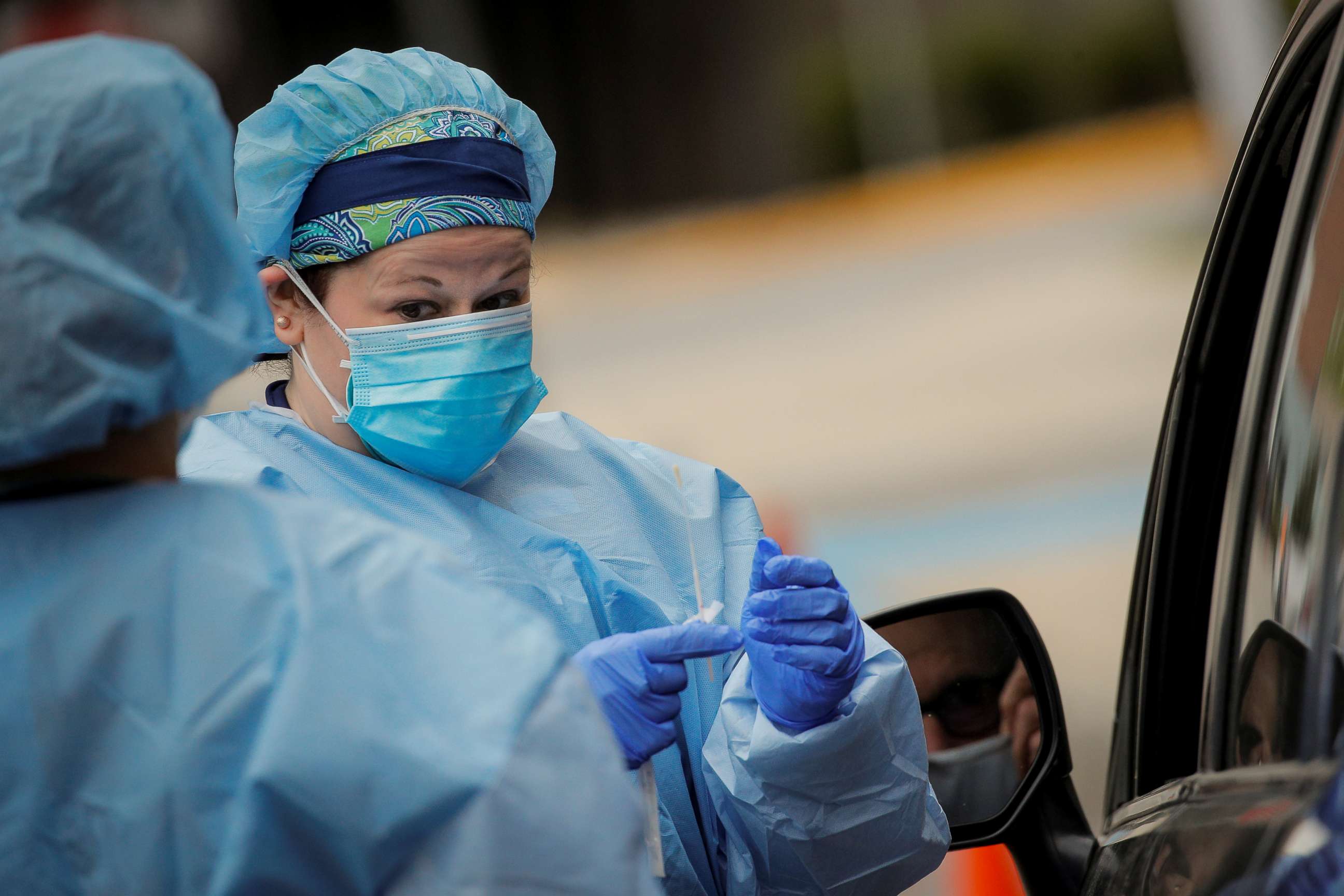 PHOTO: Nurses work at a drive-thru testing site for the coronavirus disease at North Shore University Hospital in Manhasset, N.Y., May 6, 2020.