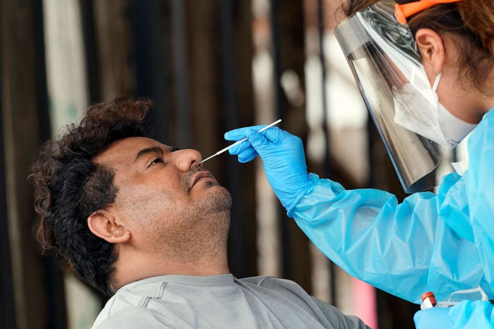 PHOTO: A man is tested at a free COVID-19 testing site, provided by United Memorial Medical Center, June 28, 2020, at the Mexican Consulate, in Houston.