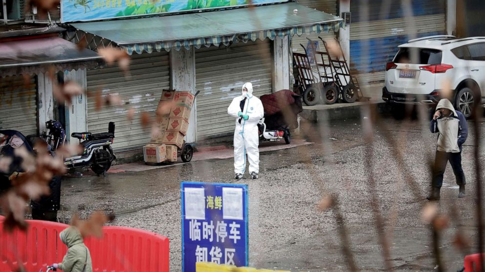 PHOTO: A worker in a protective suit is seen at the closed seafood market in Wuhan, China, Jan. 10, 2020. 