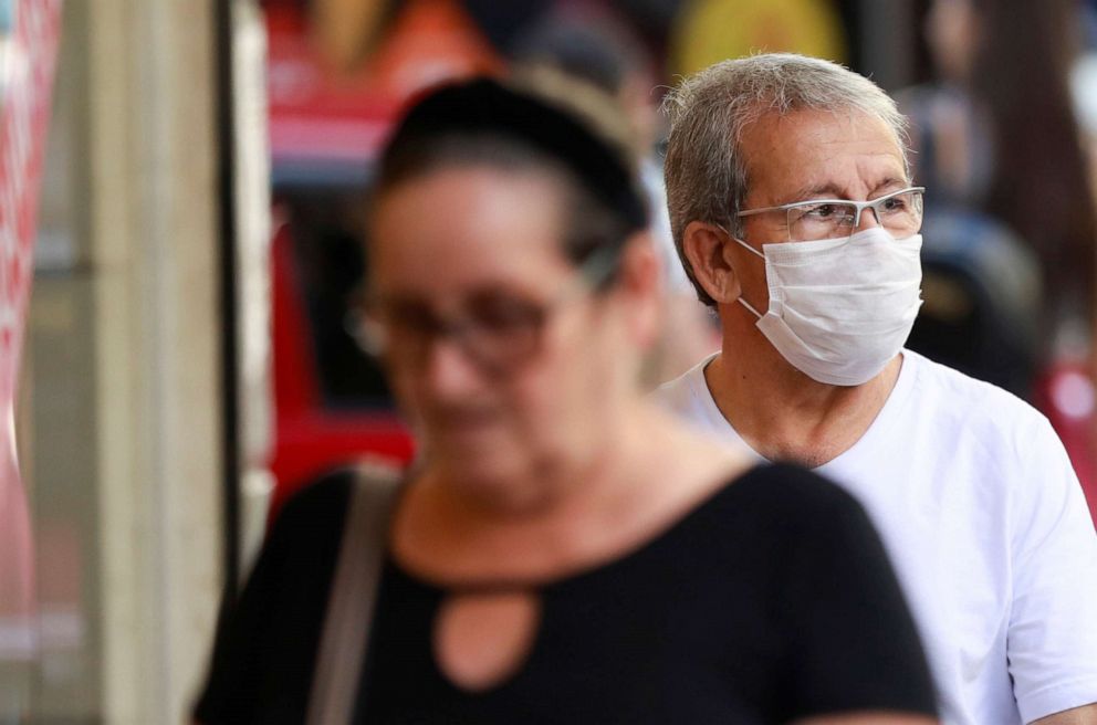 PHOTO: A man wearing a mask, following the coronavirus outbreak, walks in Porto Alegre, Brazil, Feb. 27, 2020.