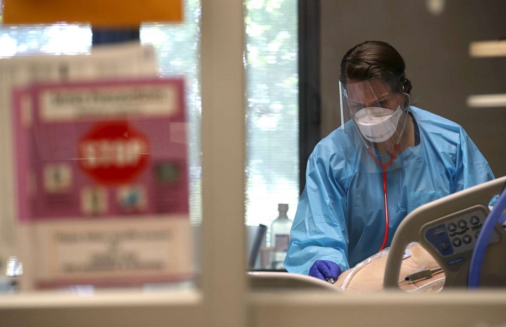 PHOTO: A nurse evaluates a coronavirus patient in the intensive care unit at Regional Medical Center on May 21, 2020, in San Jose, Calif.