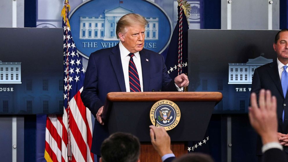 PHOTO: U.S. President Donald Trump gestures towards media members, who raise their hands to ask questions, during a news conference about the latest coronavirus disease (COVID-19) developments, August 23, 2020. 
