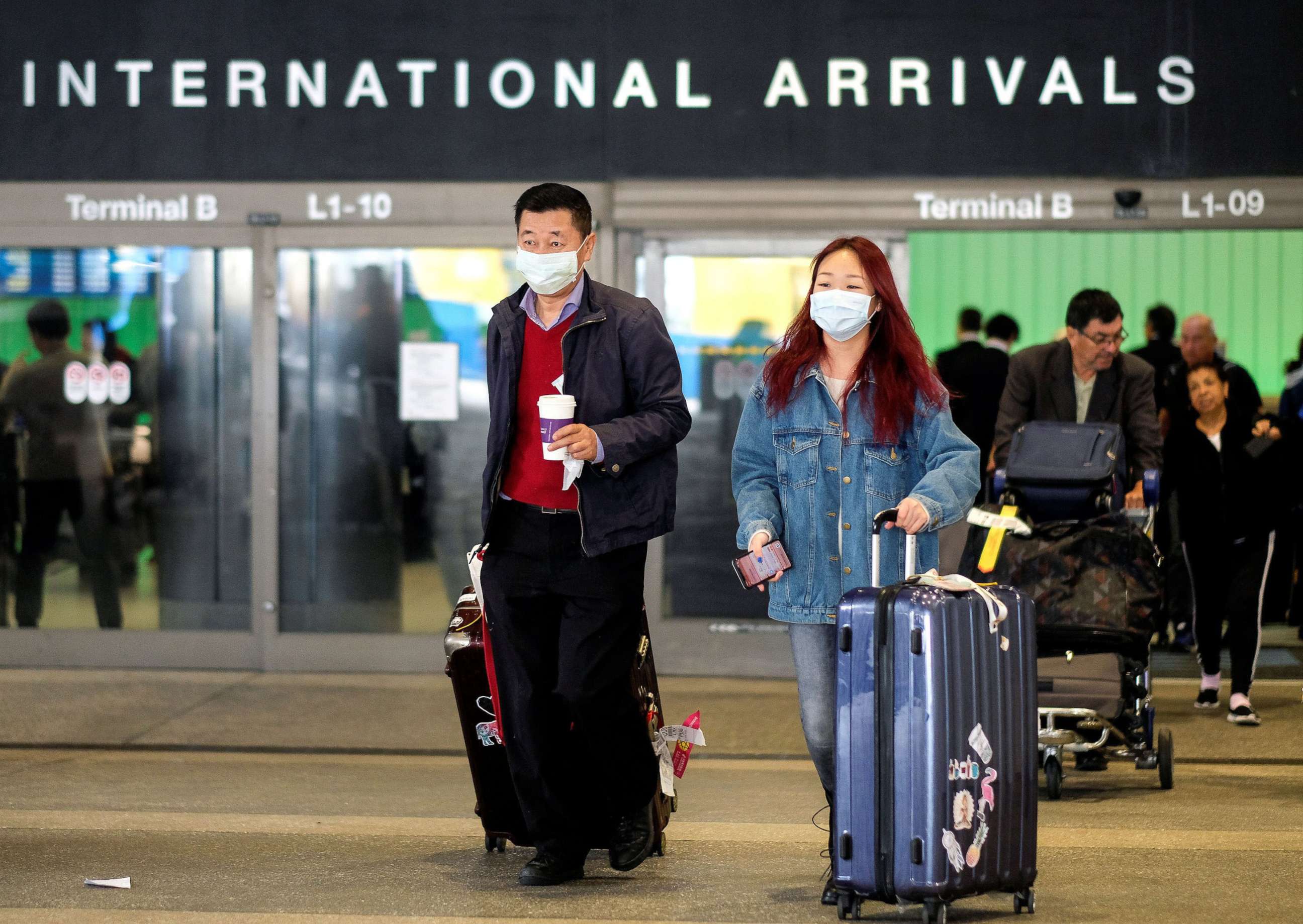 PHOTO: Passengers leave LAX after arriving from Shanghai, China, after a positive case of the coronavirus was announced in the Orange County suburb of Los Angeles, Jan. 26, 2020.