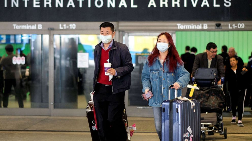 PHOTO: Passengers leave LAX after arriving from Shanghai, China, after a positive case of the coronavirus was announced in the Orange County suburb of Los Angeles, Jan. 26, 2020.