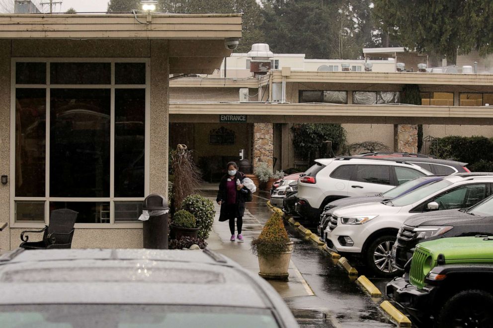 PHOTO: A worker leaves the Life Care Center of Kirkland, the long-term care facility linked to several confirmed coronavirus cases in the state, in Kirkland, Wash., March 2, 2020.