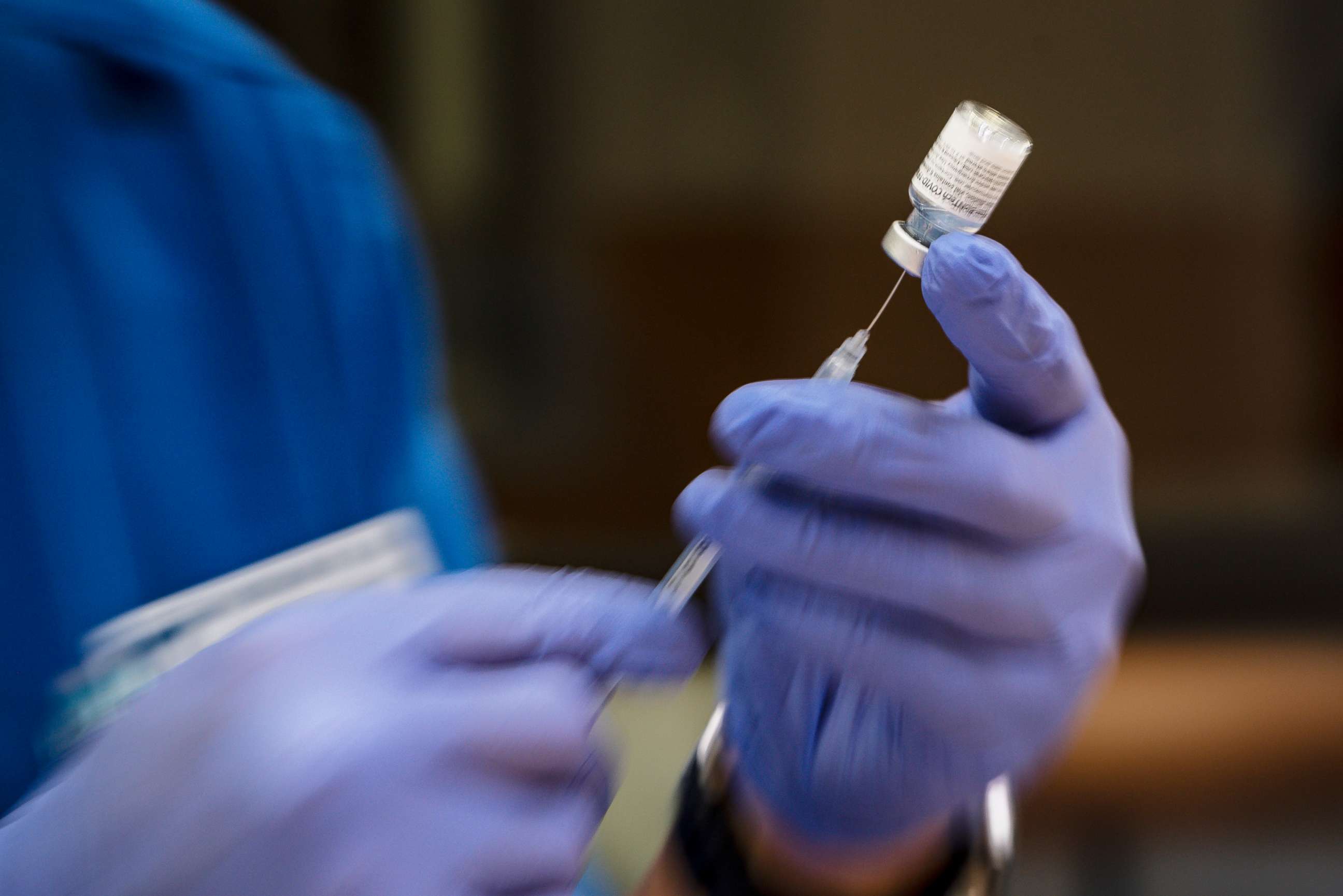 PHOTO: A nursing student prepares doses of the Pfizer COVID-19 vaccine for use in a vaccination clinic hosted by Odessa College, June 3, 2021 in Odessa, Texas.