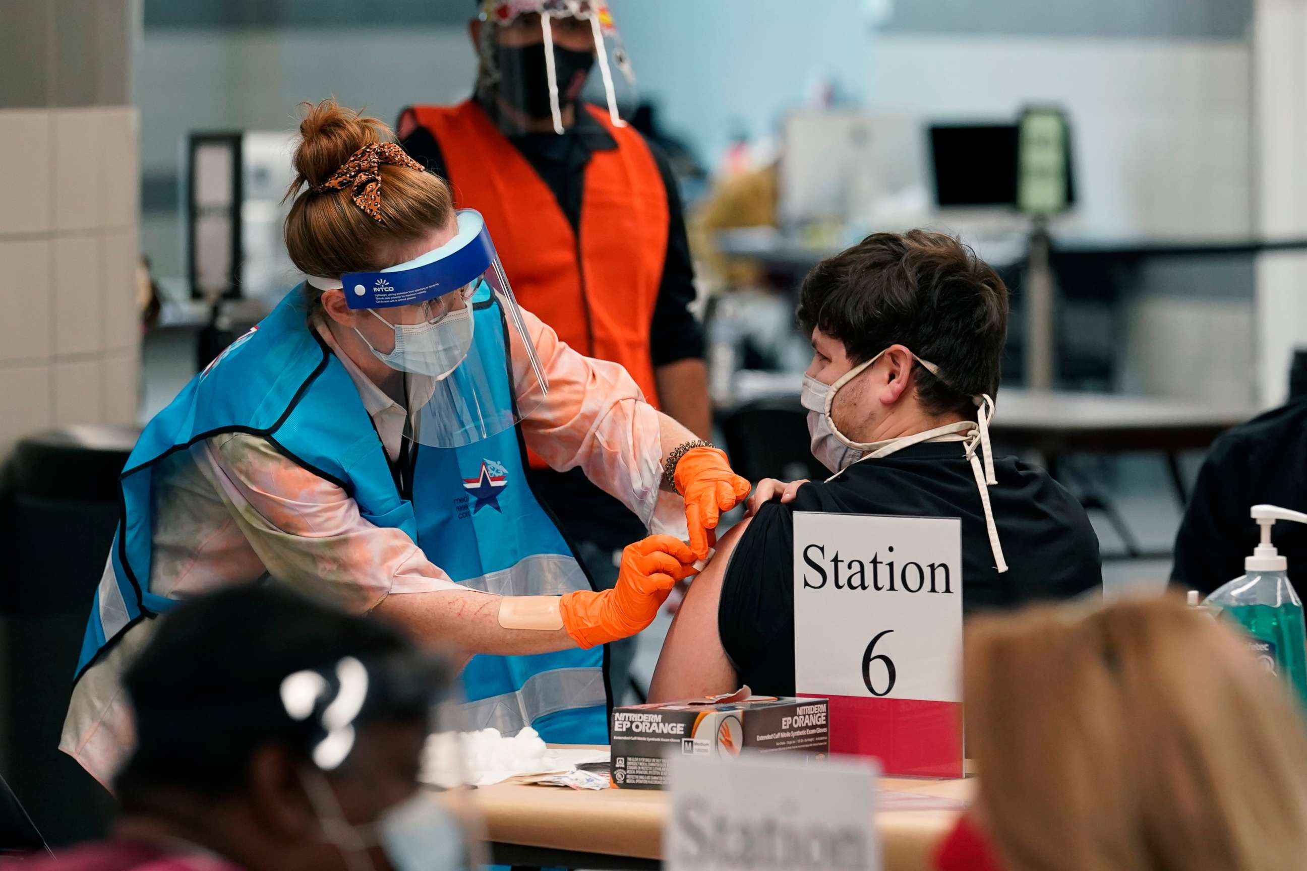 PHOTO: A health care worker administers a COVID-19 vaccination at the new Alamodome COVID-19 vaccine site, Jan. 11, 2021, in San Antonio, Texas.