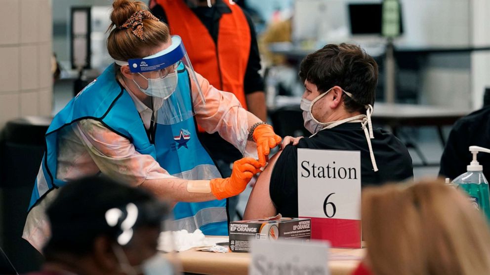 PHOTO: A health care worker administers a COVID-19 vaccination at the new Alamodome COVID-19 vaccine site, Jan. 11, 2021, in San Antonio, Texas.