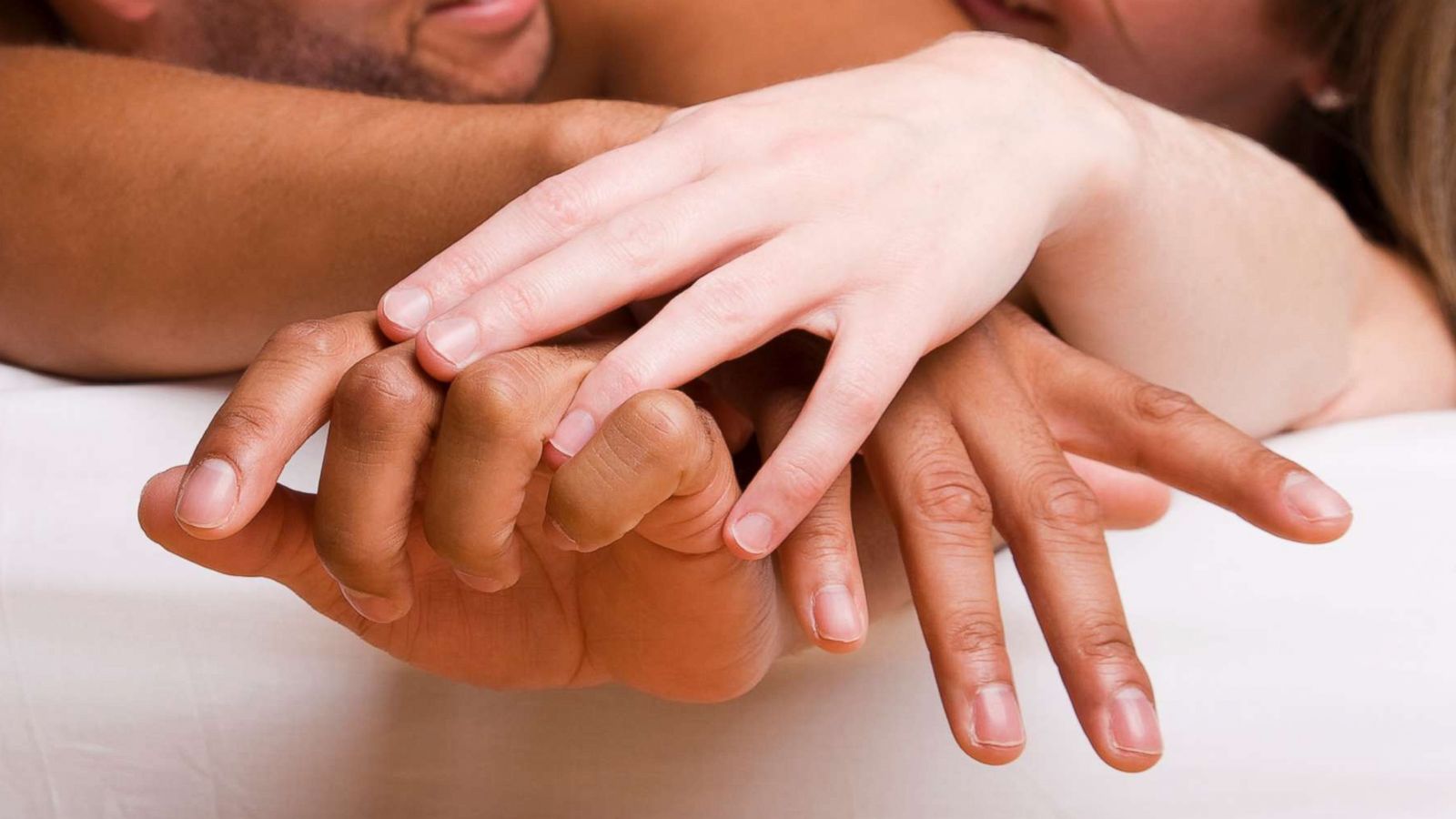 PHOTO: A man and woman lay next to each other in bed in an undated stock photo.