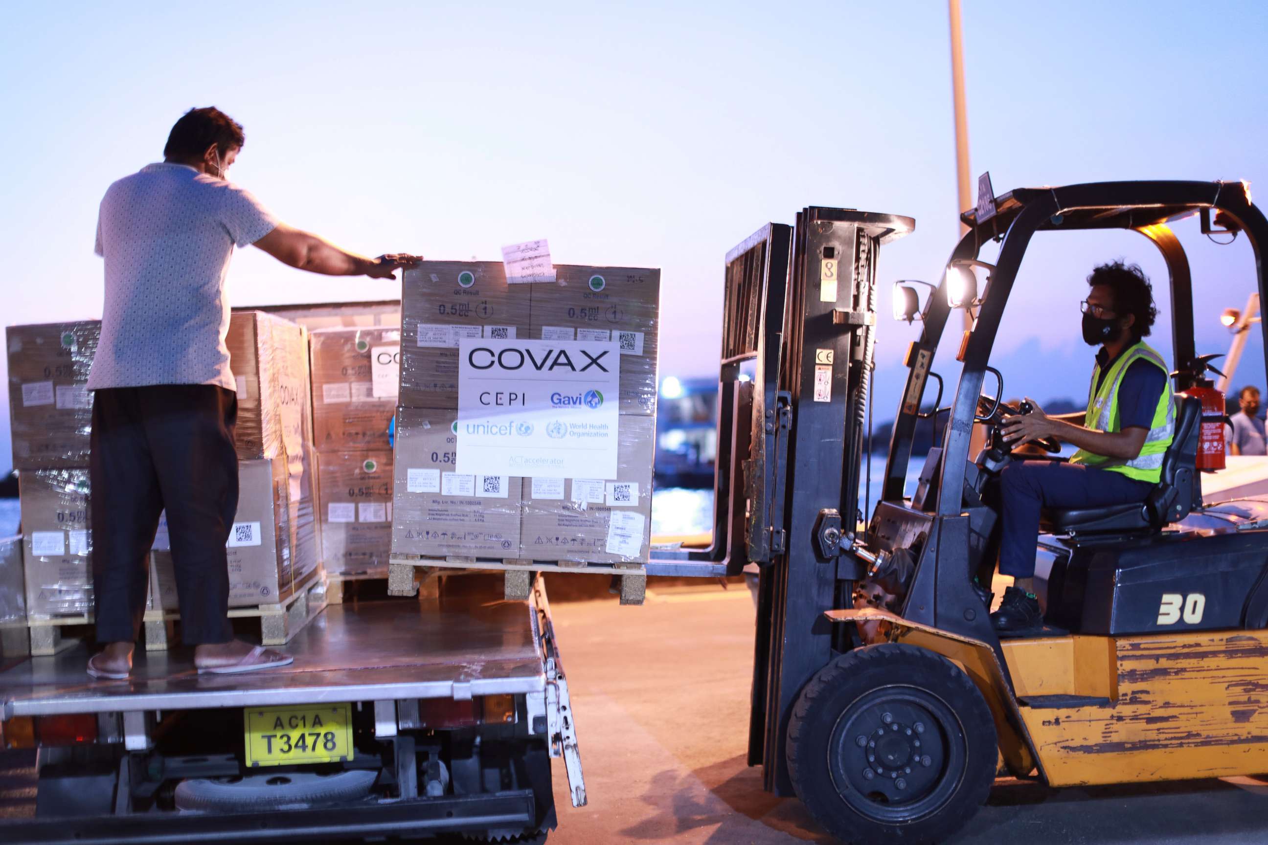 PHOTO: A shipment of 100,000 syringes and 1,000 safety boxes from UNICEF's humanitarian warehouse in Dubai are transported through the arrivals facility in Male, Maldives, Feb. 23, 2021.