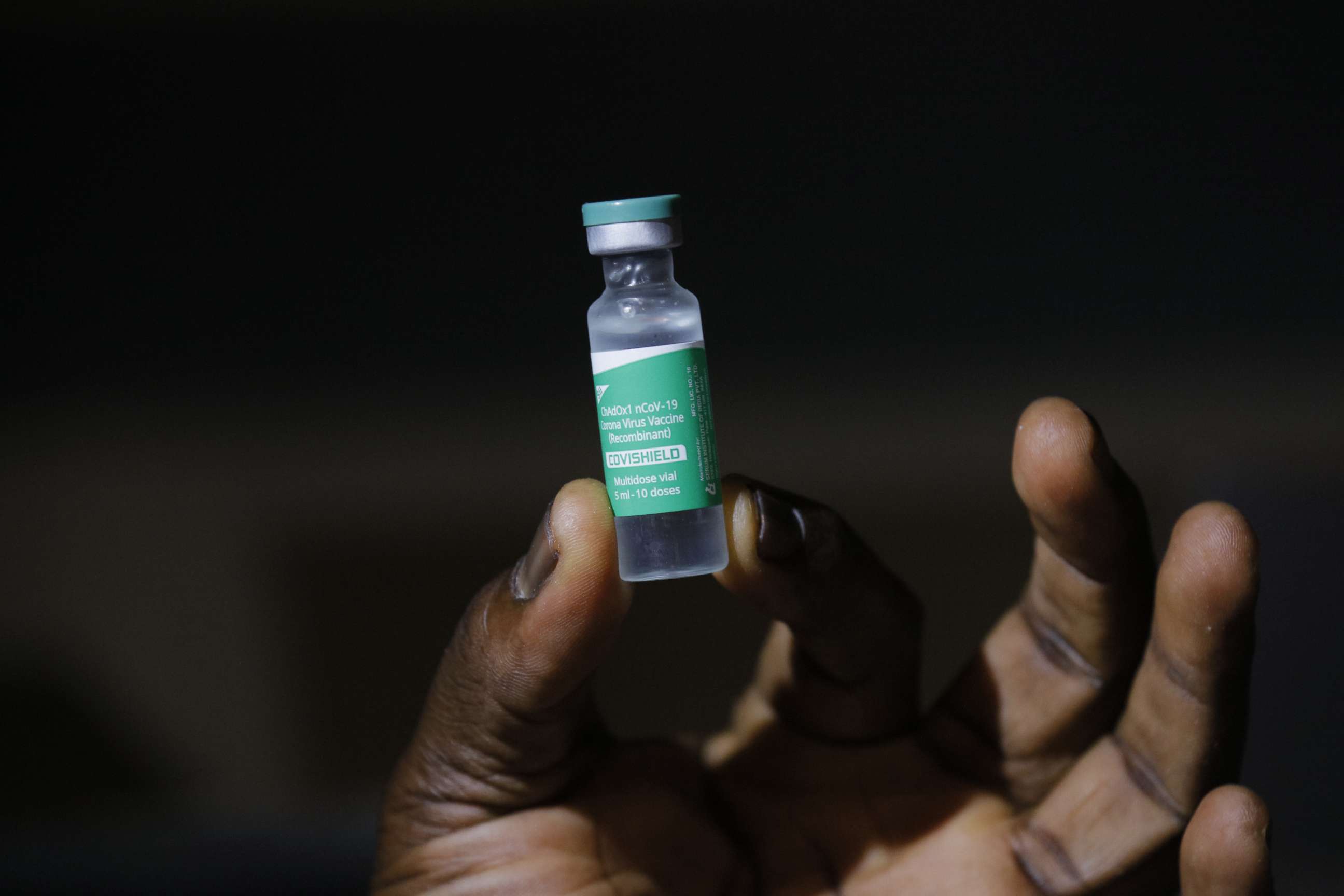 PHOTO: A staff member displays a 5ml vial of the COVID-19 vaccine, part of the first shipment of COVID-19 vaccines distributed by the COVAX Facility in Accra, Ghana's capital, Feb. 24, 2021.