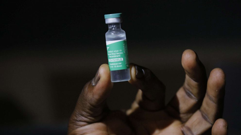 PHOTO: A staff member displays a 5ml vial of the COVID-19 vaccine, part of the first shipment of COVID-19 vaccines distributed by the COVAX Facility in Accra, Ghana's capital, Feb. 24, 2021.