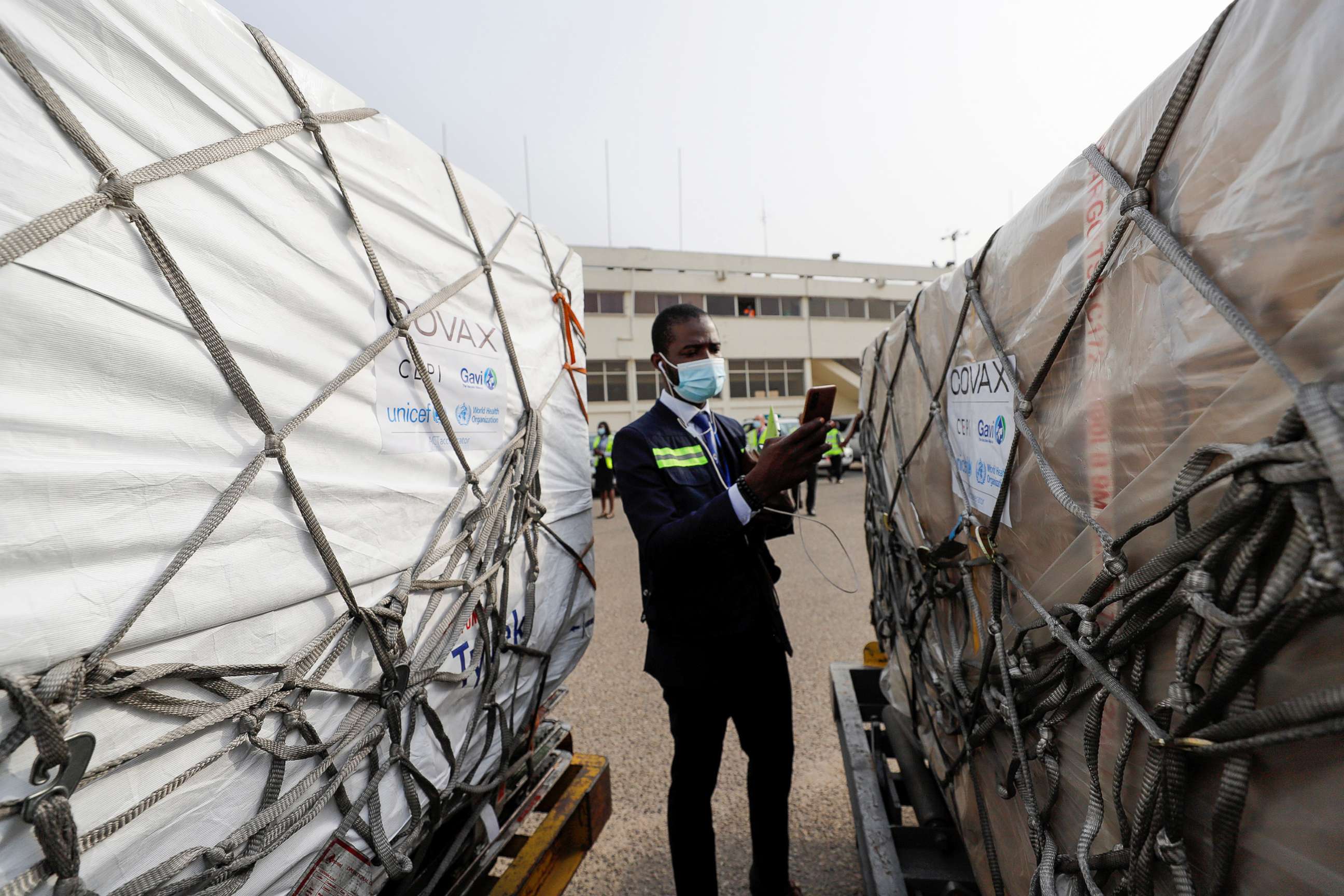 PHOTO: A worker checks boxes of AstraZeneca/Oxford vaccines as the country receives its first batch of COVID-19 vaccines under COVAX, at the international airport of Accra, Ghana Feb.24, 2021.